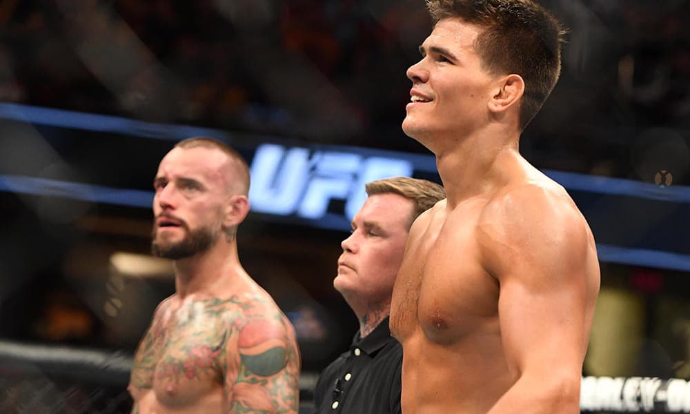 Sep 10, 2016; Cleveland, OH, USA; Mickey Gall (blue gloves) defeats C.M. Punk (red gloves) during UFC 203 at Quicken Loans Arena. Mandatory Credit: John David Mercer-USA TODAY Sports