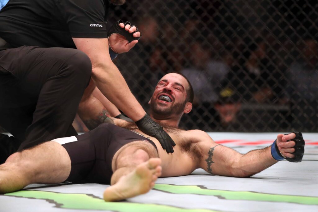 Dec 10, 2016; Toronto, ON, CAN; Matt Brown (blue gloves) reacts to fight with Donald Cerrone (red gloves) during UFC 206 at Air Canada Centre. Mandatory Credit: Tom Szczerbowski-USA TODAY Sports