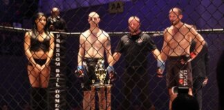 MMA betting is booming man in black tank top and blue denim jeans standing beside man in black tank top