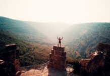 What Personality Traits Should a Champion Have? person standing on brown concrete building during daytime