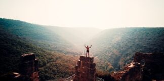 What Personality Traits Should a Champion Have? person standing on brown concrete building during daytime