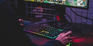 A Beginner’s Guide To Online Gaming person using desktop computer
