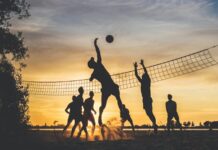 The World of Volleyball in Canada and the World: History and Rules silhouette of people playing basketball during sunset