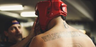 Top 3 Highest-Paid UFC Fighters of All Time person using training helmet inside the ring