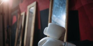 A Thorough Guide To Improving Your Footwork in Boxing White Boxing Gloves on Black Tire