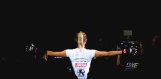 7 Ways To Bet on MMA woman wearing white shirt and black grappling gloves