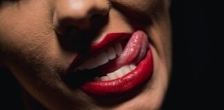 Beyond the Norm: Unveiling the Enigma of the Long Tongue Fetish woman with red lipstick and red lipstick