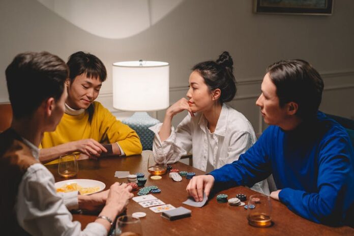 Photo by cottonbro studio Group of People Playing Poker